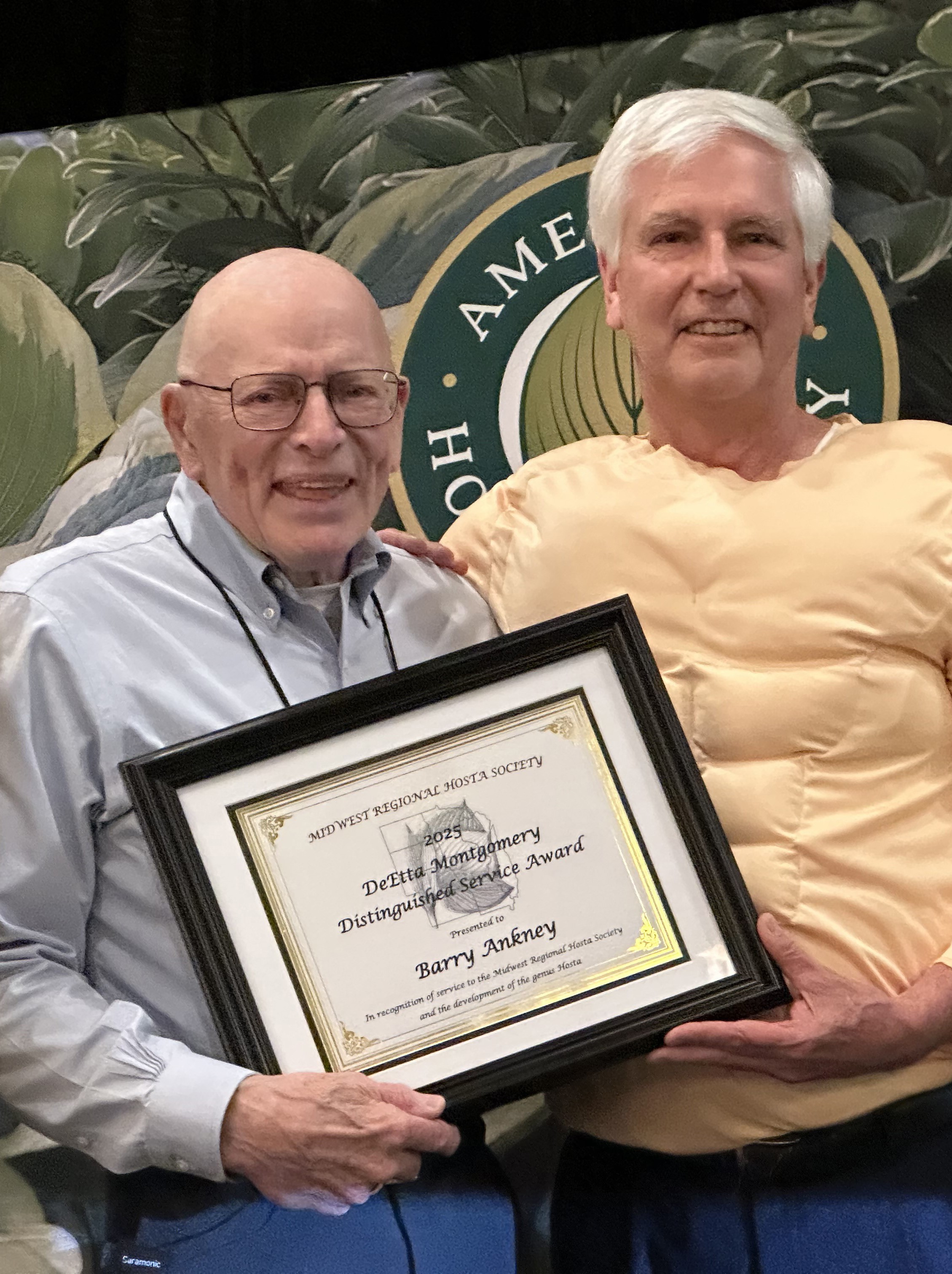 Barry Ankney receiving the award from Rob Mortko. Barry Ankney